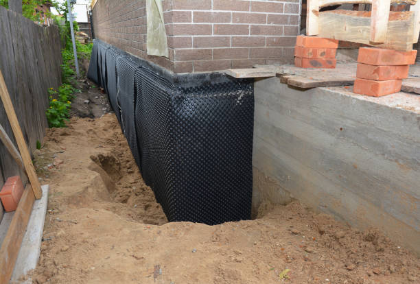 SJ Waterproofing Pros technician performing targeted Emergency Waterproofing assessment in Jamestown, NY